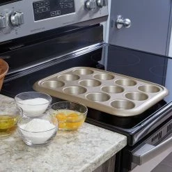 Aurelia Non-Stick 12-Cup Carbon Steel Muffin Pan in Gold by Home Basics -Cheap Bakeware Store gold home basics cupcake pans muffin pans hdc92311 31 1000